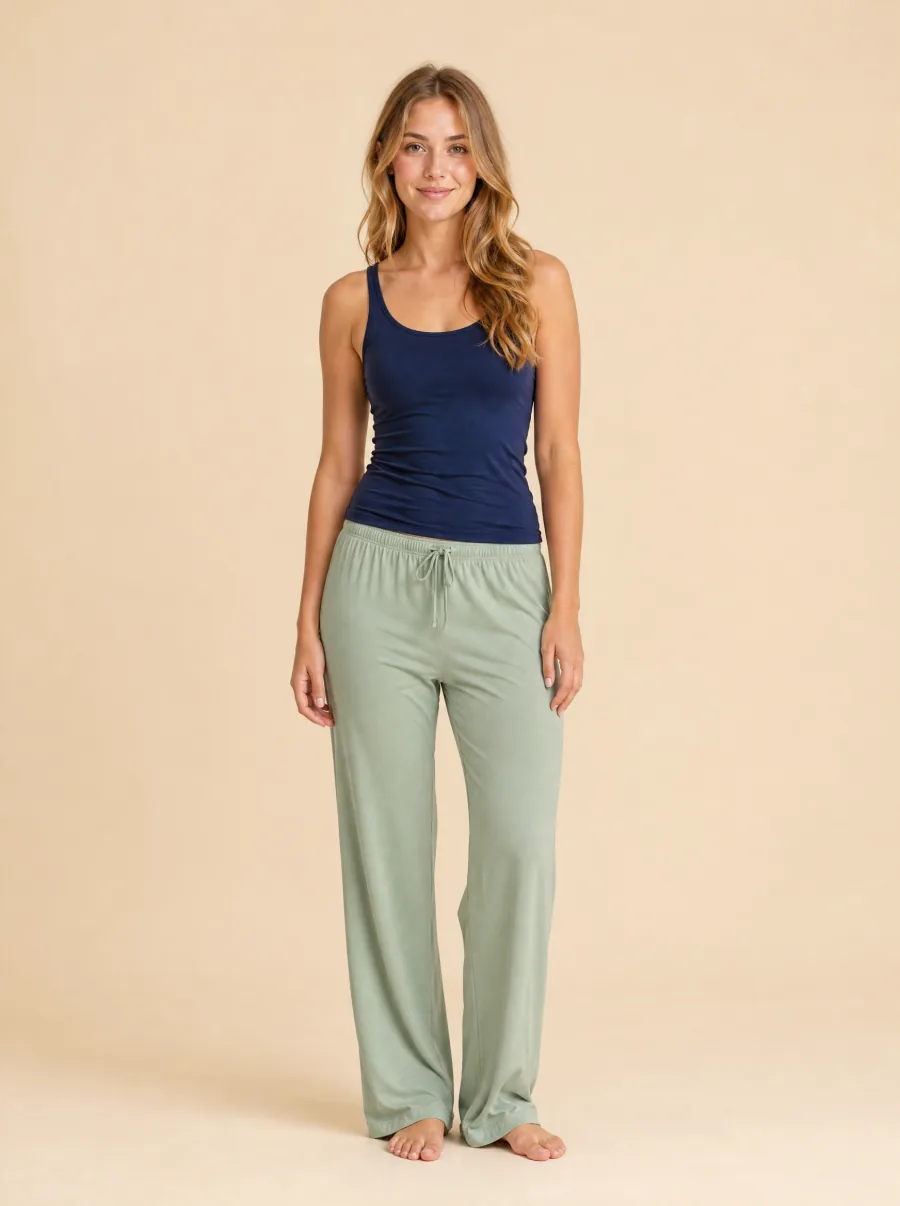 AI try-on before: woman in a navy tank and soft sage pajama pants, barefoot